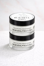Load image into Gallery viewer, Jar of mattifying moisturizer with 'Morning Mantra' branding on a light background