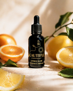 Load image into Gallery viewer, Black serum bottle with dropper labeled 'Beautiful Company' surrounded by citrus fruits on a wooden surface.