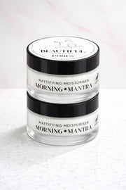 Jar of mattifying moisturizer with 'Morning Mantra' branding on a light background